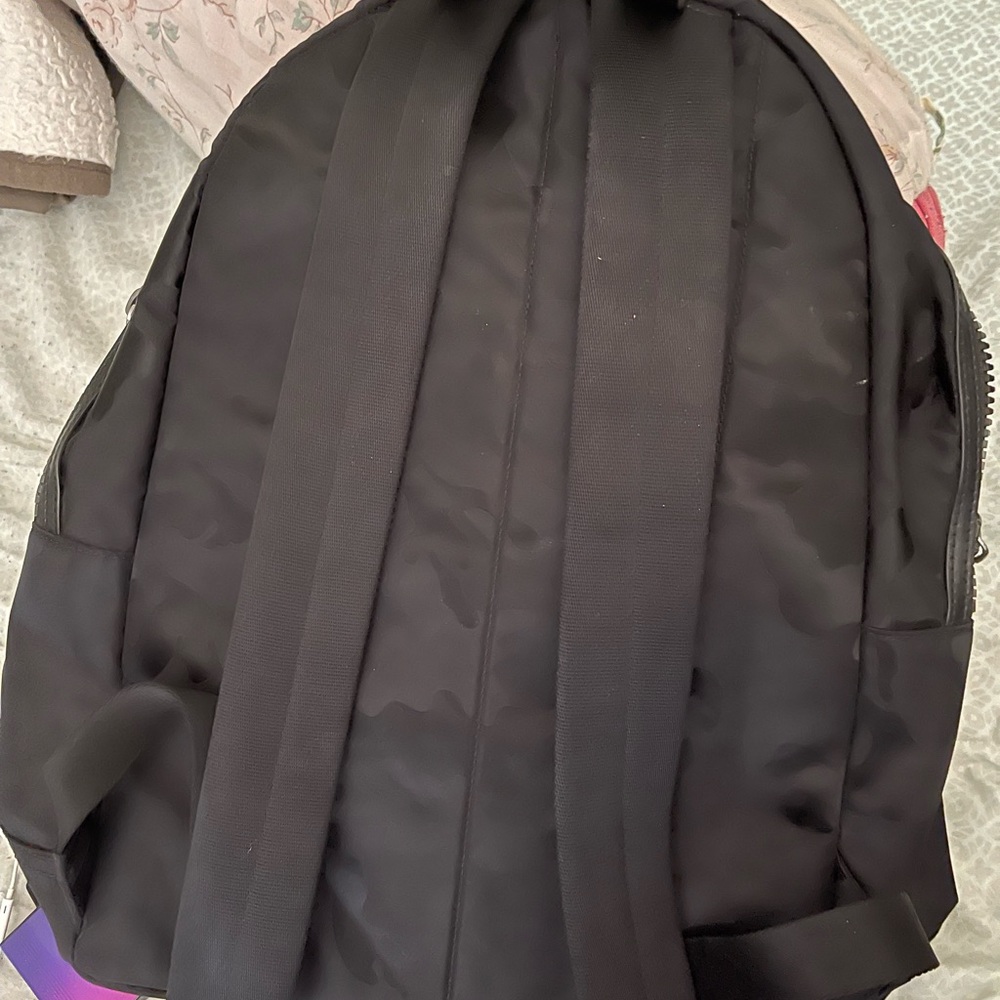 Used only a few times still brand new, no damages black camouflage, Michael Kors